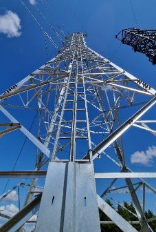 A tall metal tower with wires